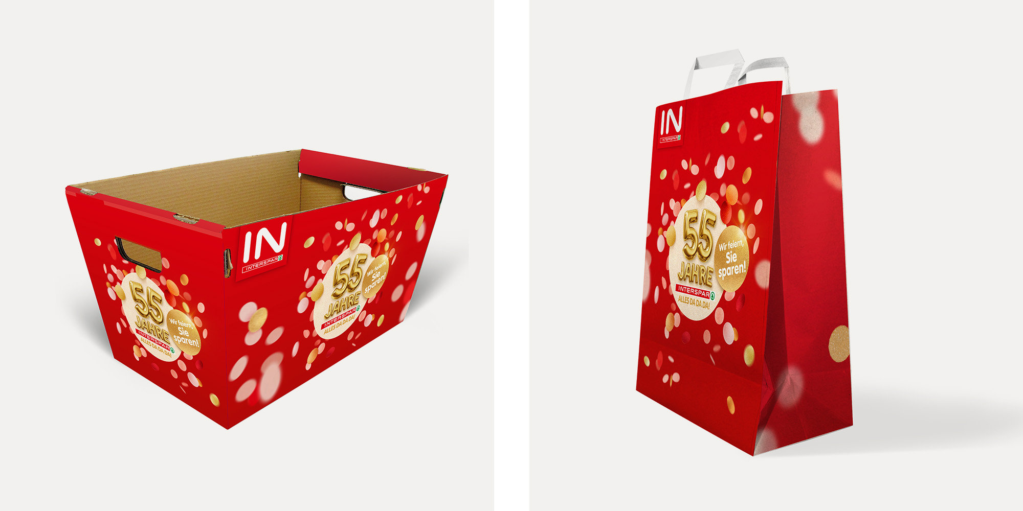 Eine Einkaufsbox und ein Papiersackerl mit Jubiläums-Branding.